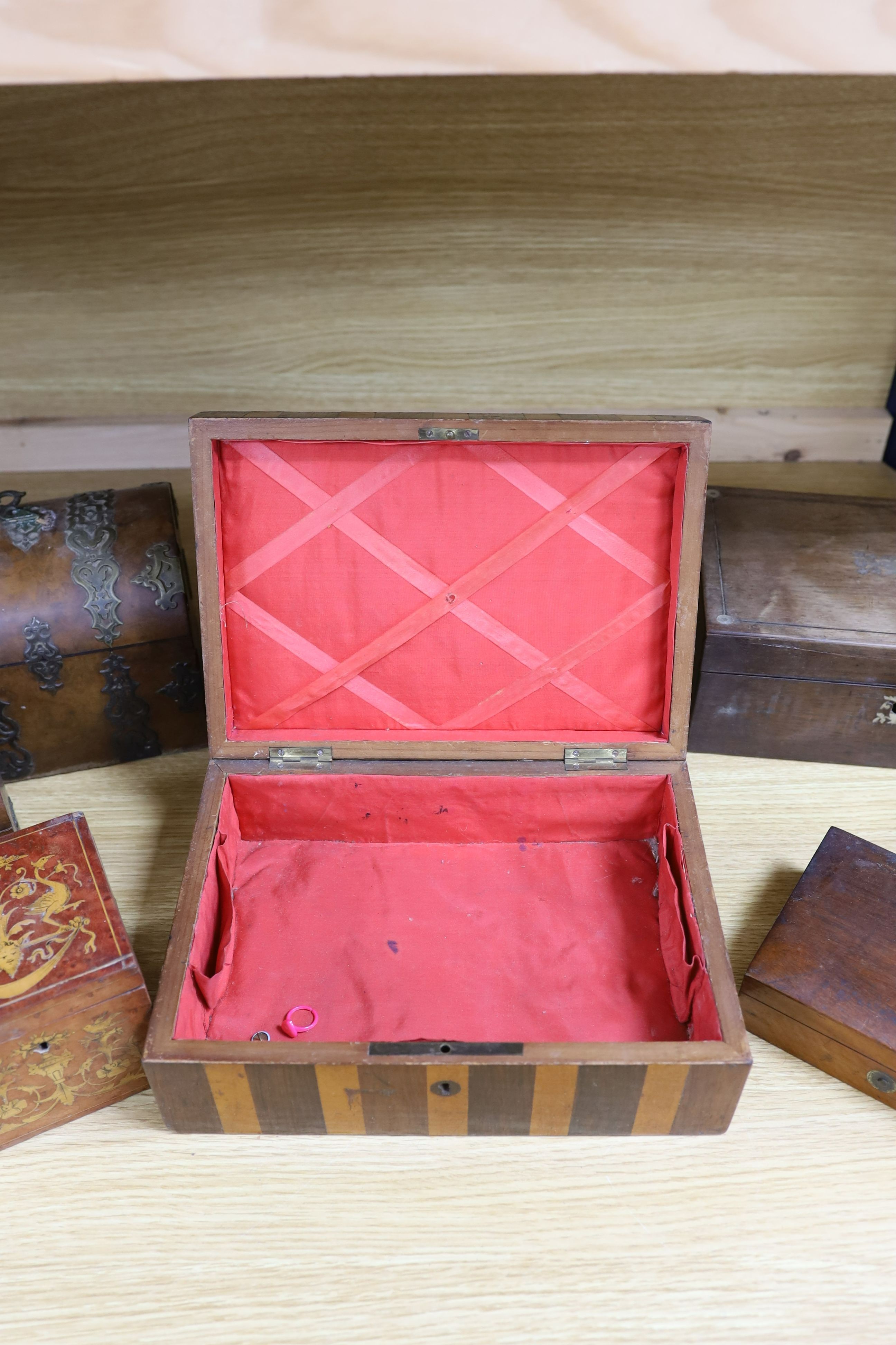 A Victorian Walnut and brass strap mounted tea caddy together with two caskets and five other boxes (8)